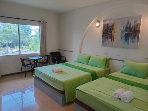 Postel nebo postele na pokoji v ubytování Fancy Carp Resort