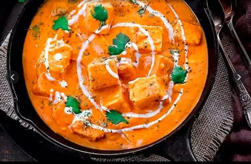 a bowl of soup with carrots and onions at Hotel International, Kolhapur in Kolhapur