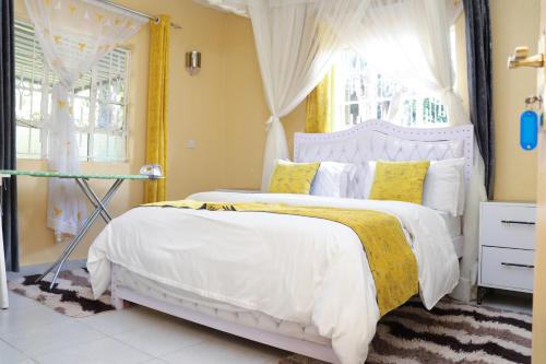 Ένα ή περισσότερα κρεβάτια σε δωμάτιο στο Aggie's BnB