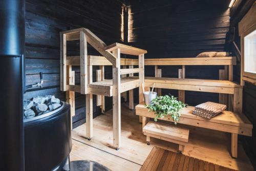 En eller flere senge i et værelse på Guesthouse & Caravan Lehtiniemi - Posio