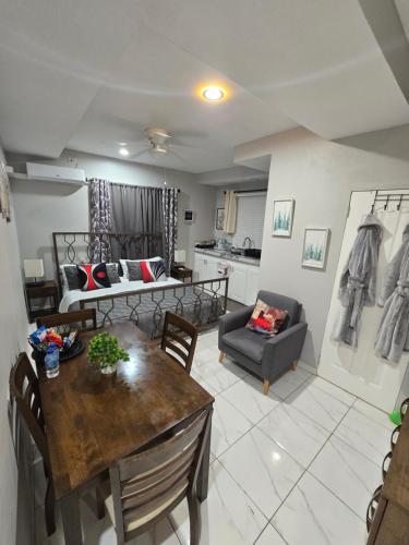 a living room with a table and a couch at El Rincón in Tunapuna