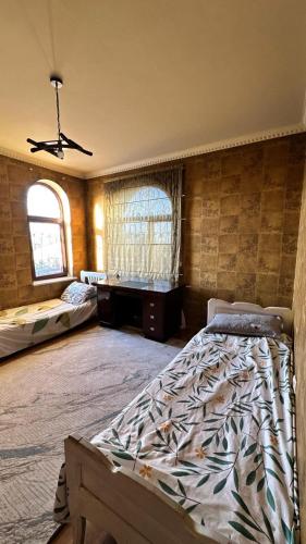 Postel nebo postele na pokoji v ubytování Гостевой дом