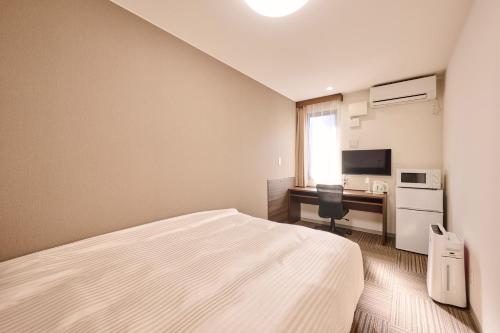 TV a/nebo společenská místnost v ubytování 未来ホテル MiraiHotel