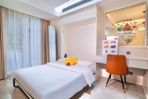 a bedroom with a white bed and a chair at 4 RMs city APT, Easy to go all attractions in Zhangjiajie