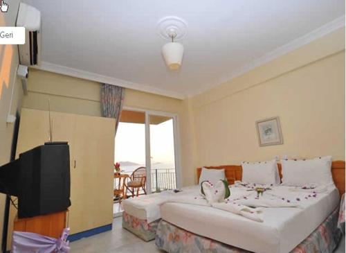Säng eller sängar i ett rum på Deniz Hotel