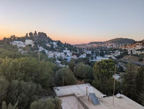 a view of a city from a hill at The Nest in the Tower in Safed