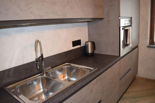 Kuchyň nebo kuchyňský kout v ubytování Baita Valtellina -Relax nel cuore delle alpi-