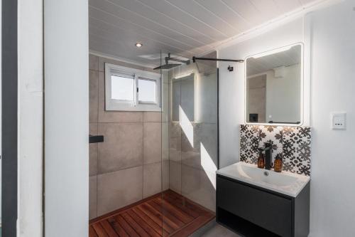 a bathroom with a sink and a shower at Chobe Princess by Mantis in Kasika