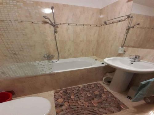 a bathroom with a sink and a tub and a toilet at Apartment in Rovinj - Istrien 43942 in Štanga