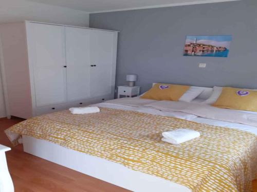 a bedroom with a bed with two towels on it at Apartment in Rovinj - Istrien 43942 in Štanga