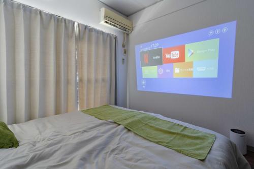 Postel nebo postele na pokoji v ubytování 3 minutes walk from Minami Fukuoka Station, free Wi-Fi