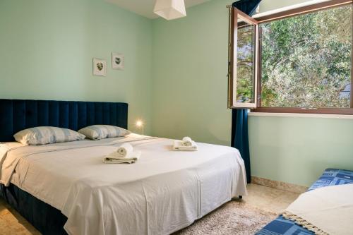 Ένα ή περισσότερα κρεβάτια σε δωμάτιο στο Appartamenti Tanja