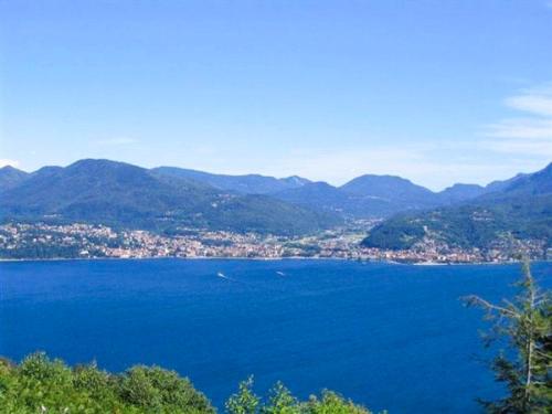 a view of a large body of water with mountains at Villa Graziosa in Trarego