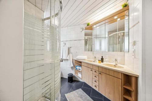 a bathroom with a sink and a toilet and a mirror at Altstadtidyll am See 1 - 6 Personen I Ruhig - Balkon - Parkplatz - nahe Bahnhof und Autobahn in Weesen
