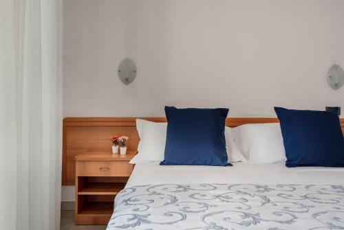 Ένα ή περισσότερα κρεβάτια σε δωμάτιο στο Residence Hotel Piccadilly