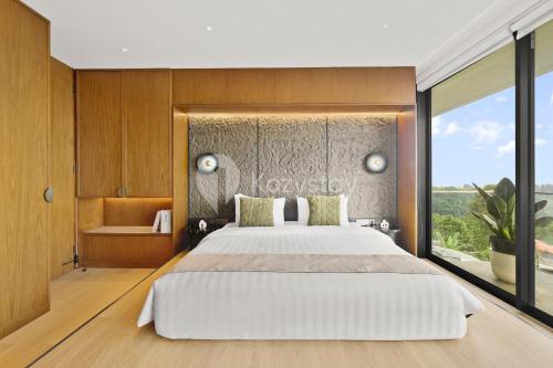 Ένα ή περισσότερα κρεβάτια σε δωμάτιο στο Calma Villa by Kozystay - Bandung