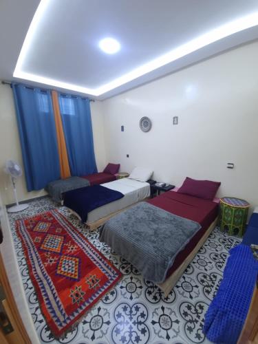 Voodi või voodid majutusasutuse Dar Kawtar toas