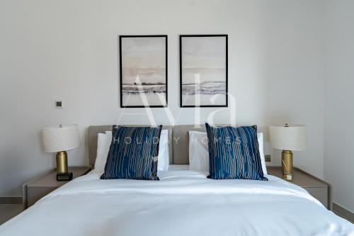 Postel nebo postele na pokoji v ubytování The Yas Coast Studio In Reem By Ayla