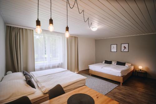 Postel nebo postele na pokoji v ubytování Hotel SKI
