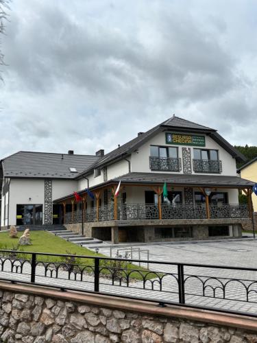a building with benches in front of it at Resursa Chęcina Restauracja & Browar & Noclegi in Chęciny