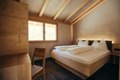 Postel nebo postele na pokoji v ubytování Chalet Hugo