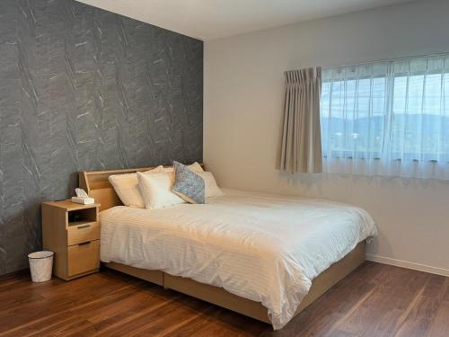 Ένα ή περισσότερα κρεβάτια σε δωμάτιο στο Akikawa Mashiki 3