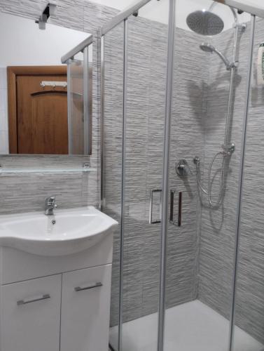 a bathroom with a shower and a sink at Nexus 2, Recale, Campania in Recale
