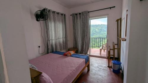 Ένα ή περισσότερα κρεβάτια σε δωμάτιο στο Nature Dream Homestay and Restaurent