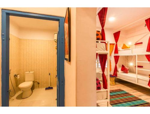 a bathroom with a toilet in a room at goSTOPS Lite Jaipur in Jaipur