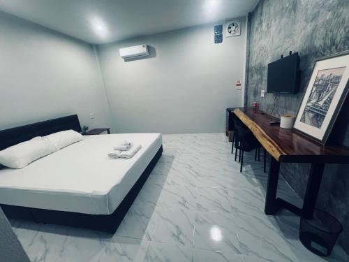 Postel nebo postele na pokoji v ubytování สวนย่า รีสอร์ท