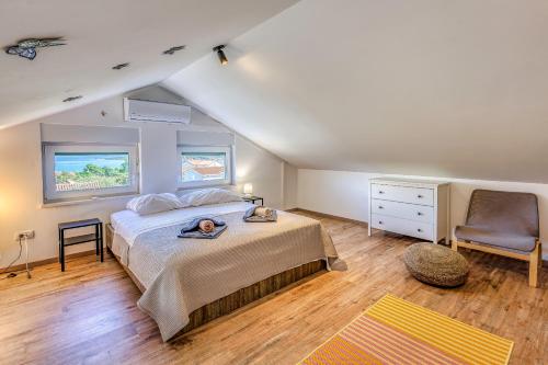 En eller flere senge i et værelse på Apartments Medna