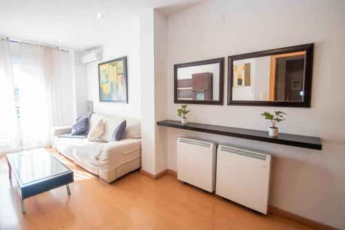 a living room with a couch and a table at Armilla Apartament in Armilla