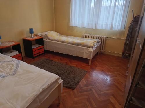 Ένα ή περισσότερα κρεβάτια σε δωμάτιο στο Nensy's apatments