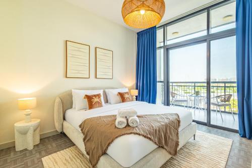 a bedroom with a large bed and a large window at Fantastic Rooftop Pool - Full Canal Views - Spacious 1 BDR Designed by Designer - 5 min walk from Space42 Arena in Abu Dhabi