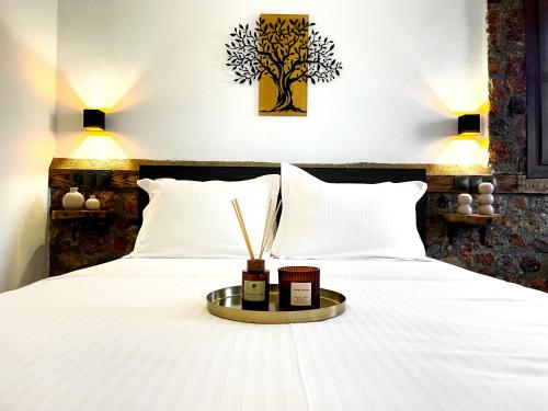 Postel nebo postele na pokoji v ubytování Archontiko Kantilis