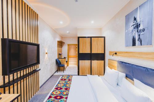 Ένα ή περισσότερα κρεβάτια σε δωμάτιο στο Art City Hotel