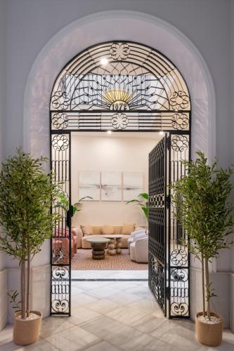 an archway in a living room with a couch at Casa 1872 Top-Luxury, by Homing U in Seville