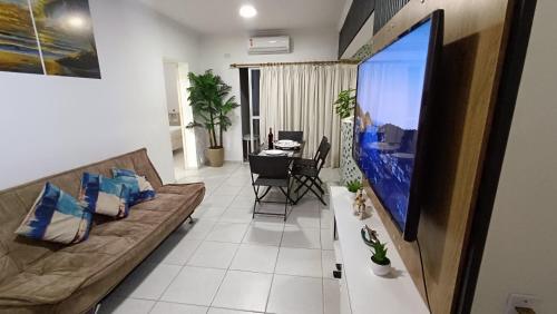 TV a/nebo společenská místnost v ubytování Apartamento - Flat Golden Beach Guarujá