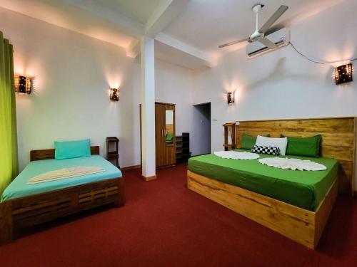 Postel nebo postele na pokoji v ubytování Eco Lodges by Ceylon Adventures