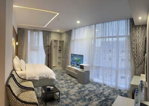 Μια τηλεόραση ή/και κέντρο ψυχαγωγίας στο Dancenter Hotel Near Jeddah Airport