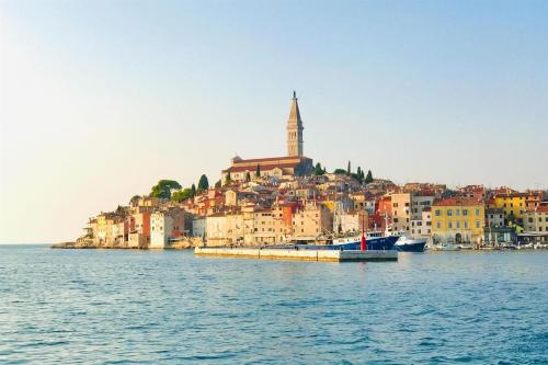 a city on the shore of a body of water at Apartments Regent 2 in Rovinj