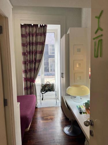 a room with a table and a chair and a window at Donnalbina 7 The Fresh BB in Naples