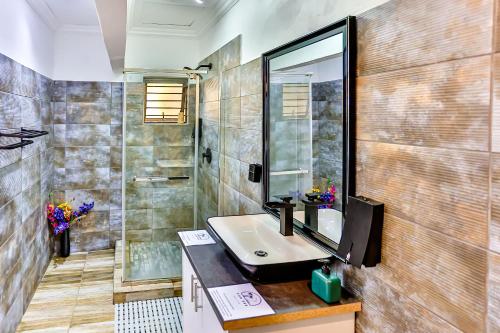 a bathroom with a sink and a mirror at Van Gogh in Ballito