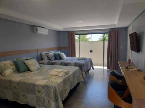 Postel nebo postele na pokoji v ubytování Apart hotel Corbari