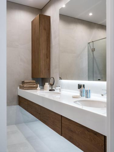 a bathroom with a sink and a mirror at A27 Apartments in Almaty