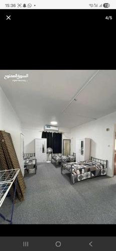 a room with couches and tables in a building at Sharing flat for LADIES ONLY in Sharjah
