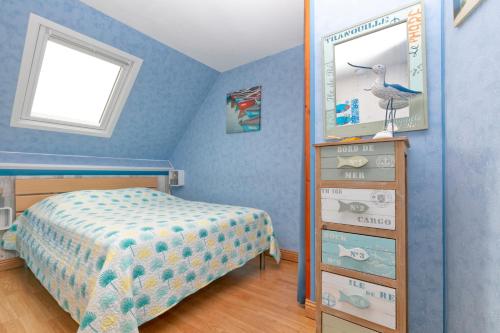 Ένα ή περισσότερα κρεβάτια σε δωμάτιο στο Le pré Nantais proche plage