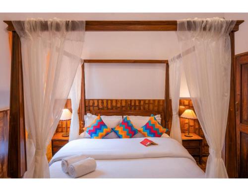 Ένα ή περισσότερα κρεβάτια σε δωμάτιο στο goSTOPS Ooty