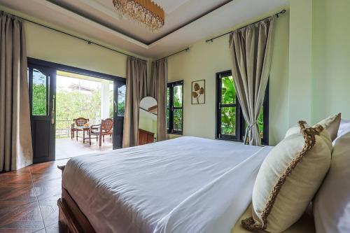 Postel nebo postele na pokoji v ubytování Dream Villa 1bd with a swimming pool