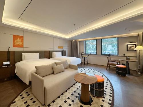 En eller flere senge i et værelse på The Bund Hotel